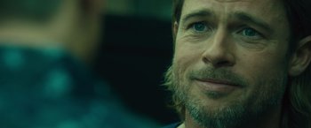 Movie still from “World War Z” (2013), directed by Marc Forster – A person with a beard; Close Up shot, Over the shoulder angle