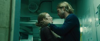 Movie still from “World War Z” (2013), directed by Marc Forster – A man and a woman standing next to each other; Close Up shot, Low angle