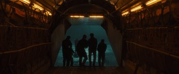 Movie still from “World War Z” (2013), directed by Marc Forster – A group of people standing in front of an underwater tunnel; Extreme Wide shot, Low angle