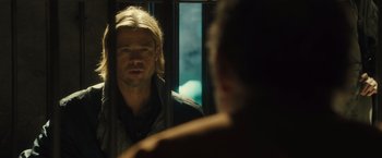 Movie still from “World War Z” (2013), directed by Marc Forster – A man looking at himself in the mirror; Close Up shot, Over the shoulder angle