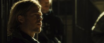 Movie still from “World War Z” (2013), directed by Marc Forster – A person with a beard; Close Up shot, Over the shoulder angle