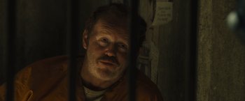 Movie still from “World War Z” (2013), directed by Marc Forster – A person in a jail cell; Close Up shot, Over the shoulder angle