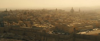 Movie still from “World War Z” (2013), directed by Marc Forster – An aerial view of a large city in the middle of the day; Extreme Wide shot, High angle