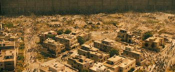 Movie still from “World War Z” (2013), directed by Marc Forster – An aerial view of an urban area with a lot of trash; Extreme Wide shot, Overhead angle