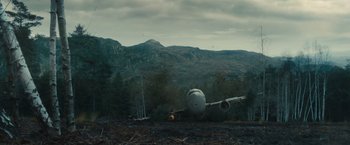 Movie still from “World War Z” (2013), directed by Marc Forster – An airplane sitting on top of an airport runway; Extreme Wide shot, Low angle