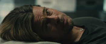 Movie still from “World War Z” (2013), directed by Marc Forster – A person laying on the ground; Close Up shot, Low angle