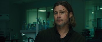 Movie still from “World War Z” (2013), directed by Marc Forster – A man in a black shirt and some blood on his face; Close Up shot, Low angle
