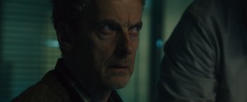 Movie still from “World War Z” (2013), directed by Marc Forster – A person looking at the camera; Close Up shot, Over the shoulder angle