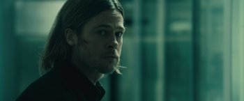 Movie still from “World War Z” (2013), directed by Marc Forster – A person with long hair; Close Up shot, Over the shoulder angle