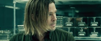 Movie still from “World War Z” (2013), directed by Marc Forster – A person with long hair; Close Up shot, Over the shoulder angle