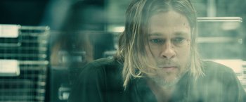 Movie still from “World War Z” (2013), directed by Marc Forster – A person with long hair; Close Up shot, Over the shoulder angle