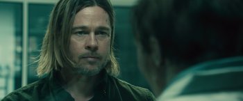 Movie still from “World War Z” (2013), directed by Marc Forster – A person in a mirror with a beard; Close Up shot, Over the shoulder angle