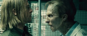 Movie still from “World War Z” (2013), directed by Marc Forster – A man and a woman face to face in a room; Close Up shot, Over the shoulder angle