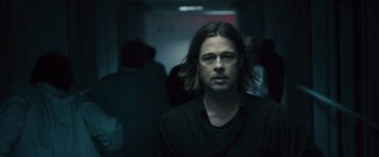 Movie still from “World War Z” (2013), directed by Marc Forster – A person with long hair; Close Up shot, Over the shoulder angle