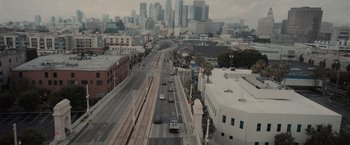 Movie still from “Wrath of Man” (2021), directed by Guy Ritchie – A view of a city from a high up view point; Extreme Wide shot, High angle