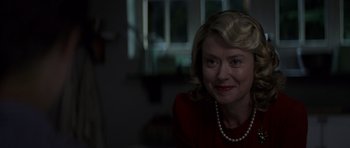 Movie still from “X-Men: First Class” (2011), directed by Matthew Vaughn – A person wearing a red shirt; Close Up shot, Over the shoulder angle