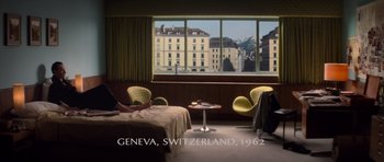 Movie still from “X-Men: First Class” (2011), directed by Matthew Vaughn – A hotel room with a view of a city; Wide shot, High angle