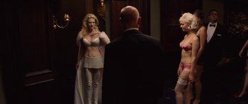 Movie still from “X-Men: First Class” (2011), directed by Matthew Vaughn – A man and a woman dressed in white in front of a mirror; Medium shot, Over the shoulder angle