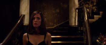 Movie still from “X-Men: First Class” (2011), directed by Matthew Vaughn – A woman standing in front of some stairs; Close Up shot, Low angle