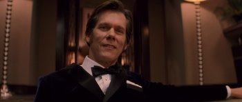 Movie still from “X-Men: First Class” (2011), directed by Matthew Vaughn – A person wearing a suit and bow tie; Close Up shot, Low angle