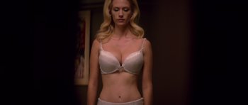 Movie still from “X-Men: First Class” (2011), directed by Matthew Vaughn – A woman in a white bra and white underwear; Medium shot, Low angle