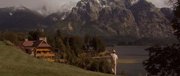 Movie still from “X-Men: First Class” (2011), directed by Matthew Vaughn – A man standing on top of a grass covered hill; Extreme Wide shot, Low angle