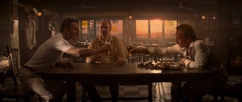 Movie still from “X-Men: First Class” (2011), directed by Matthew Vaughn – A group of people sitting at a table drinking wine; Medium shot, Low angle