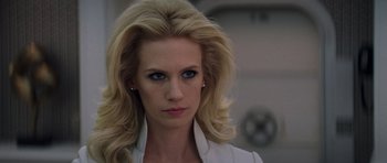 Movie still from “X-Men: First Class” (2011), directed by Matthew Vaughn – A woman with blonde hair wearing a white shirt; Close Up shot, Over the shoulder angle