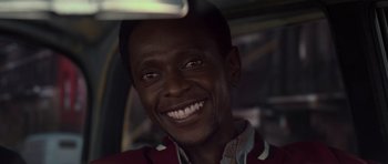 Movie still from “X-Men: First Class” (2011), directed by Matthew Vaughn – A person with a smile on their face; Close Up shot, Low angle