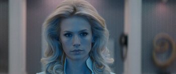 Movie still from “X-Men: First Class” (2011), directed by Matthew Vaughn – A woman with blonde hair and blue eye shadow; Close Up shot, Low angle