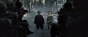 Movie still from “X-Men: First Class” (2011), directed by Matthew Vaughn – Two men are standing in the middle of a forest; Wide shot, Over the shoulder angle