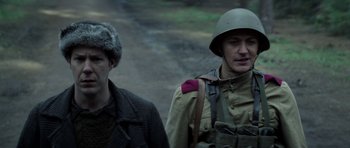 Movie still from “X-Men: First Class” (2011), directed by Matthew Vaughn – A man in a military uniform standing next to another man; Close Up shot, Over the shoulder angle