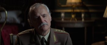 Movie still from “X-Men: First Class” (2011), directed by Matthew Vaughn – An older man wearing a military uniform; Close Up shot, Over the shoulder angle