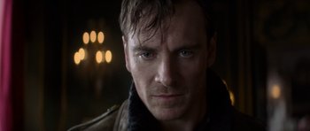 Movie still from “X-Men: First Class” (2011), directed by Matthew Vaughn – A man's face in the dark; Close Up shot, Over the shoulder angle