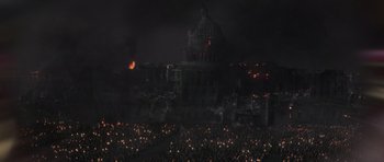 Movie still from “X-Men: First Class” (2011), directed by Matthew Vaughn – A crowd of people standing in front of a building at night; Extreme Wide shot, High angle