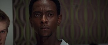 Movie still from “X-Men: First Class” (2011), directed by Matthew Vaughn – A man's face in front of a wall; Close Up shot, Low angle