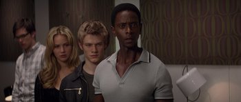 Movie still from “X-Men: First Class” (2011), directed by Matthew Vaughn – A group of young men standing next to each other in a room; Close Up shot, Over the shoulder angle