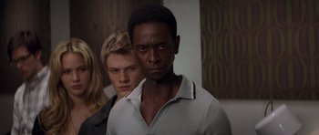 Movie still from “X-Men: First Class” (2011), directed by Matthew Vaughn – A man standing next to another man in front of a wall; Close Up shot, Low angle