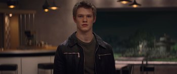 Movie still from “X-Men: First Class” (2011), directed by Matthew Vaughn – A young man in a leather jacket looking at the camera; Close Up shot, Low angle