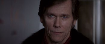 Movie still from “X-Men: First Class” (2011), directed by Matthew Vaughn – A person wearing a jacket; Close Up shot, Low angle