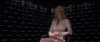 Movie still from “X-Men: First Class” (2011), directed by Matthew Vaughn – A woman sitting in front of a wall of sound waves; Medium shot, Over the shoulder angle