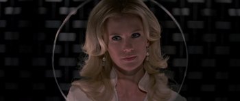 Movie still from “X-Men: First Class” (2011), directed by Matthew Vaughn – A woman with blonde hair holding an umbrella; Close Up shot, Low angle