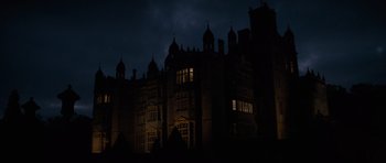 Movie still from “X-Men: First Class” (2011), directed by Matthew Vaughn – A building that is lit up at night time; Extreme Wide shot, Low angle