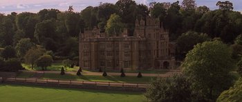 Movie still from “X-Men: First Class” (2011), directed by Matthew Vaughn – An old building with a large lawn in front of it; Extreme Wide shot, High angle