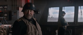 Movie still from “X-Men: First Class” (2011), directed by Matthew Vaughn – An older man wearing a helmet and a vest; Close Up shot, Low angle