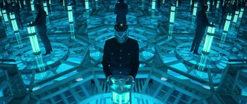 Movie still from “X-Men: First Class” (2011), directed by Matthew Vaughn – A man wearing a helmet standing in a room with blue lights; Medium shot, High angle