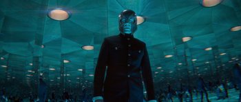 Movie still from “X-Men: First Class” (2011), directed by Matthew Vaughn – A man in a suit and helmet stands in a room; Medium shot, Low angle