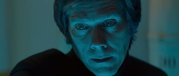 Movie still from “X-Men: First Class” (2011), directed by Matthew Vaughn – A person's face with blue lighting; Close Up shot, Overhead angle