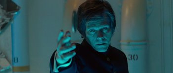 Movie still from “X-Men: First Class” (2011), directed by Matthew Vaughn – A man in a black shirt is holding something in his hand; Close Up shot, Low angle