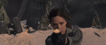 Movie still from “X-Men: First Class” (2011), directed by Matthew Vaughn – A woman is holding something in her hand; Close Up shot, Low angle